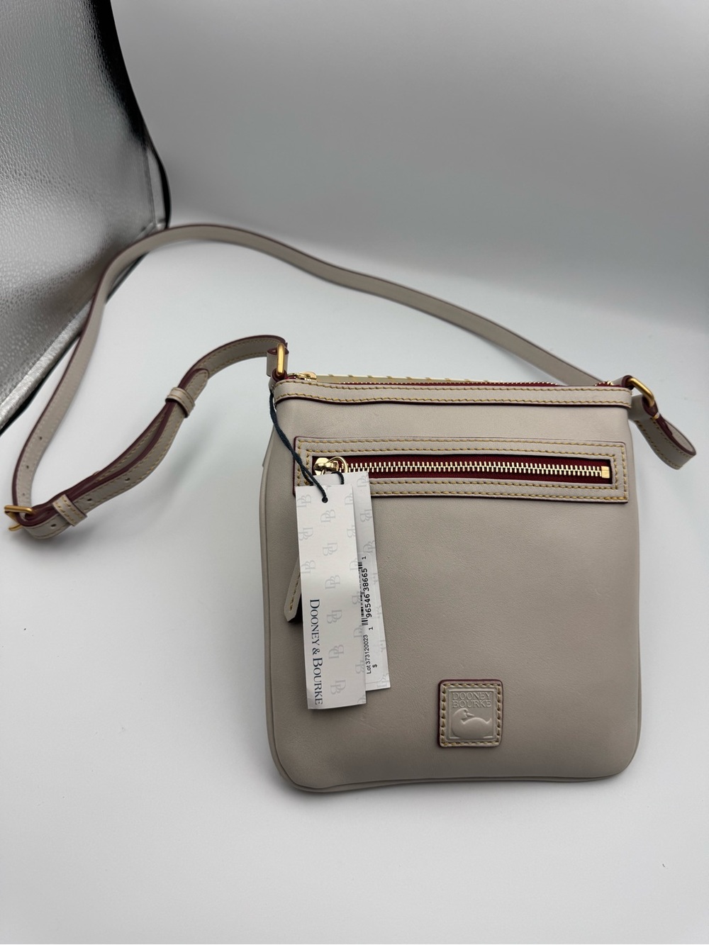 Dooney & Bourke Taupe Leather Crossbody with Red and Gold Zipper Accents